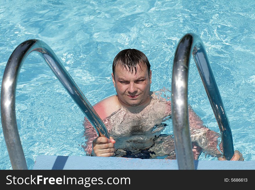 Portrait of man in a swimming pool. Portrait of man in a swimming pool