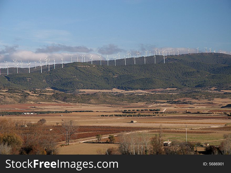 Landscape with a fields and windmills in Navarra, Spain. Landscape with a fields and windmills in Navarra, Spain