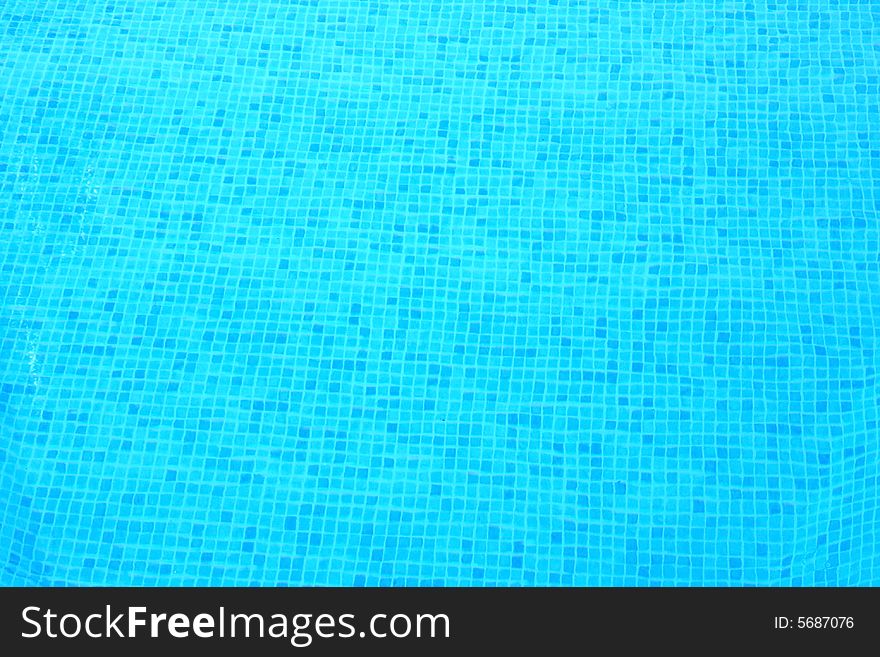 Blue transparent and clear water in swimming pool.