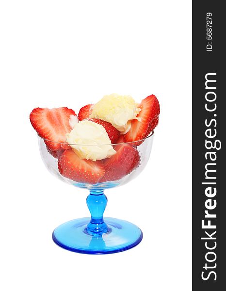 Strawberries and clotted cream in a sundae glass. Strawberries and clotted cream in a sundae glass