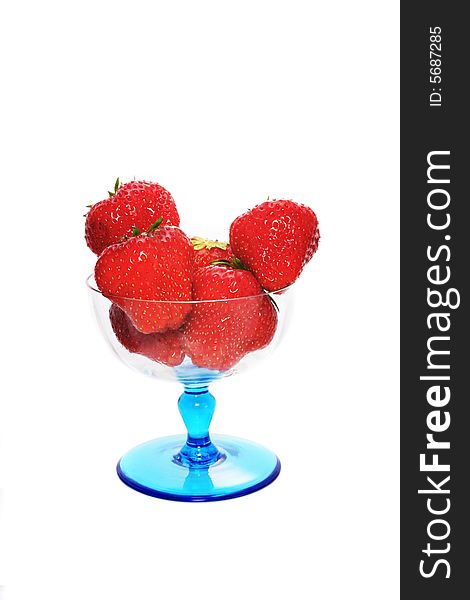 Strawberries in a sundae glass isolated on white. Strawberries in a sundae glass isolated on white