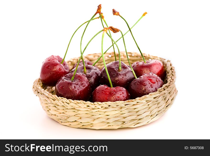 High resolution image of wet fresh cherries in a basket