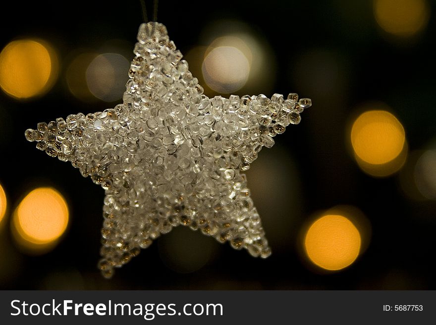 Silver star and light on the christmas tree. Silver star and light on the christmas tree