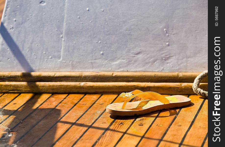 Summer series: yellow bedroom-slipper on the yach deck. Summer series: yellow bedroom-slipper on the yach deck