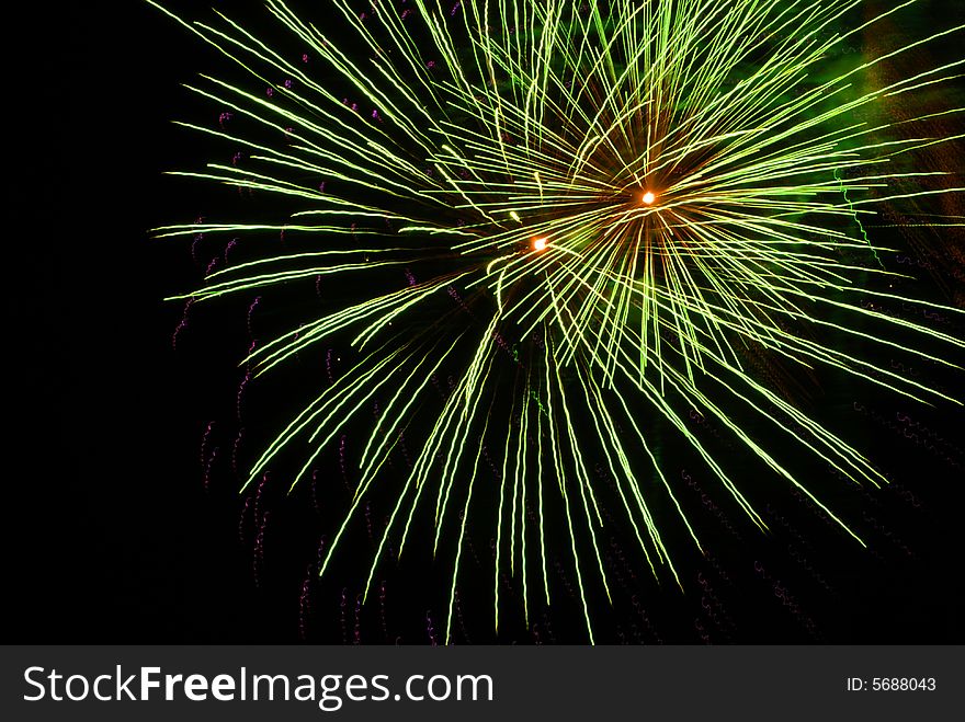 Green Fireworks display against the night sky