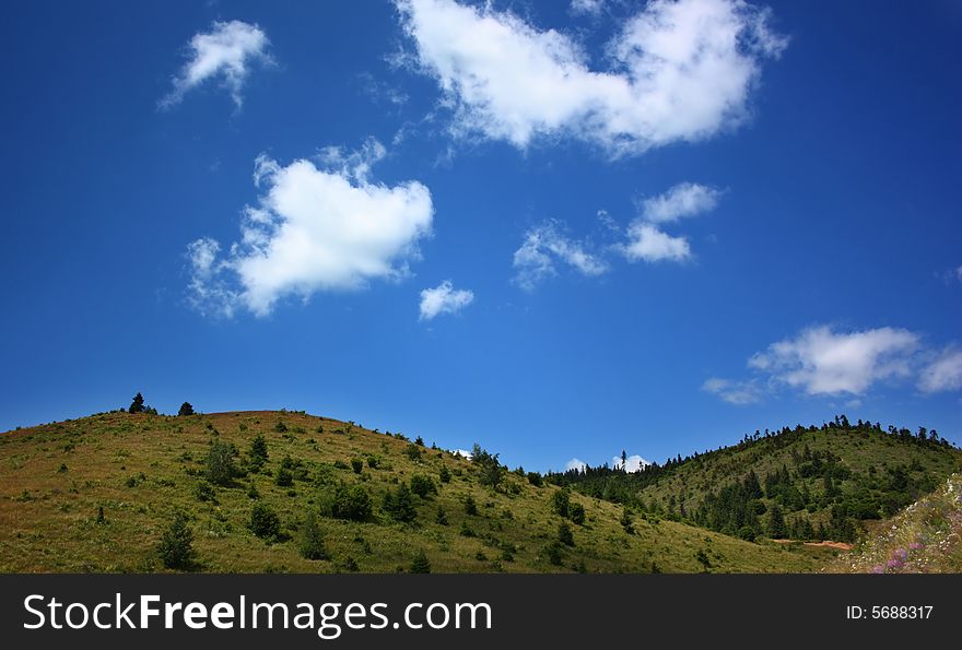 Green hills and beautiful summer sky with clouds. Green hills and beautiful summer sky with clouds