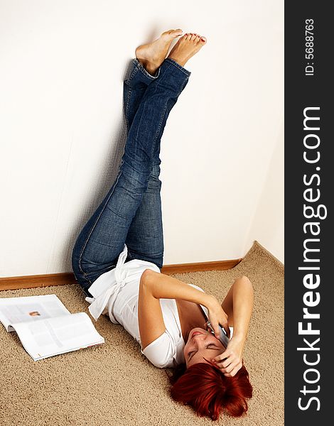 Young happy woman is calling on the phone