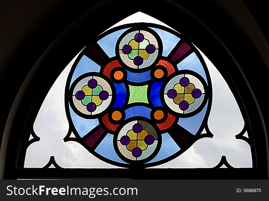 Ancient stained-glass window photographed in old church