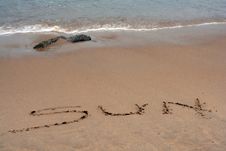 The Word SUN Written In Sand Royalty Free Stock Image The Word SUN Written In Sand Royalty Free Stock Image