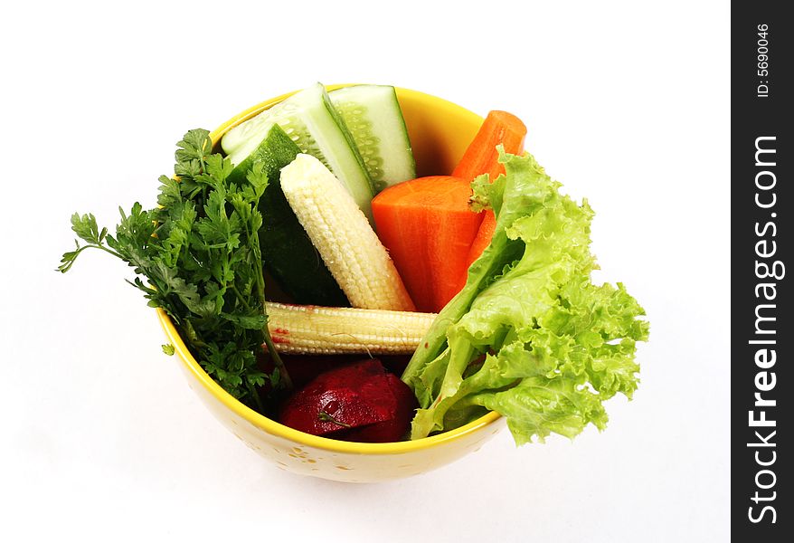 Bowl of fresh vegetables isolated on white. Bowl of fresh vegetables isolated on white.