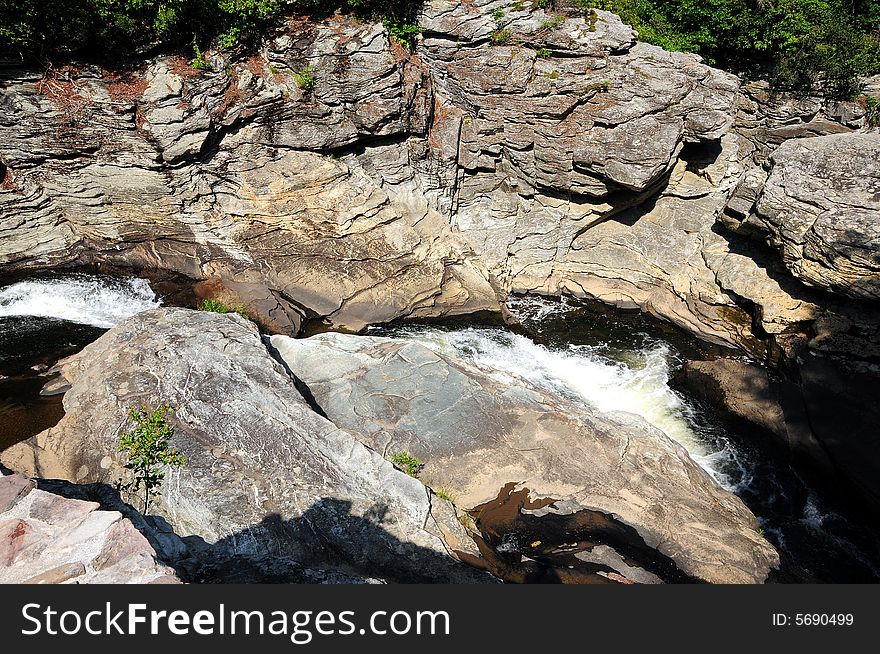 Red rocks in a mountain stream of fresh crystalline water. Red rocks in a mountain stream of fresh crystalline water