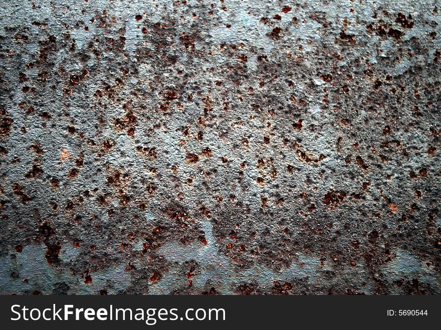 Rusty metal with corrode mottles