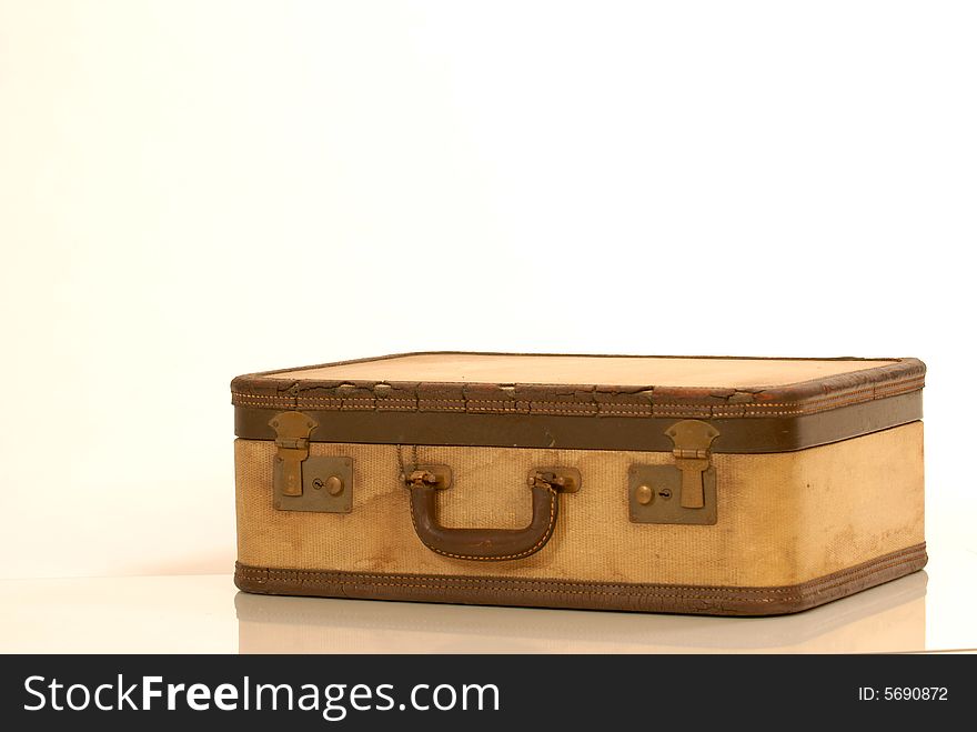 Brown vintage suitcase against white background