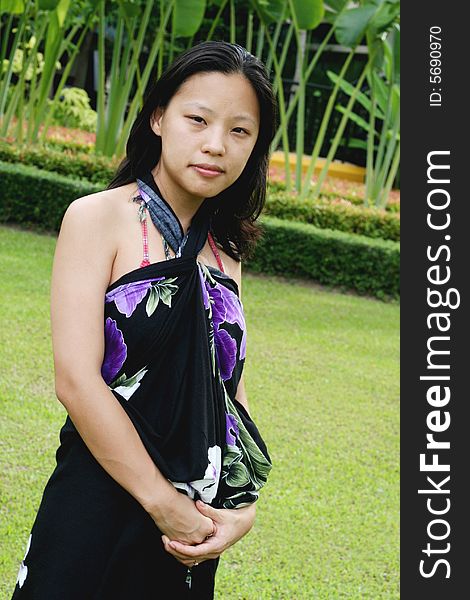 Portrait of a happy Korean woman dressed in a summer sarong. Portrait of a happy Korean woman dressed in a summer sarong.