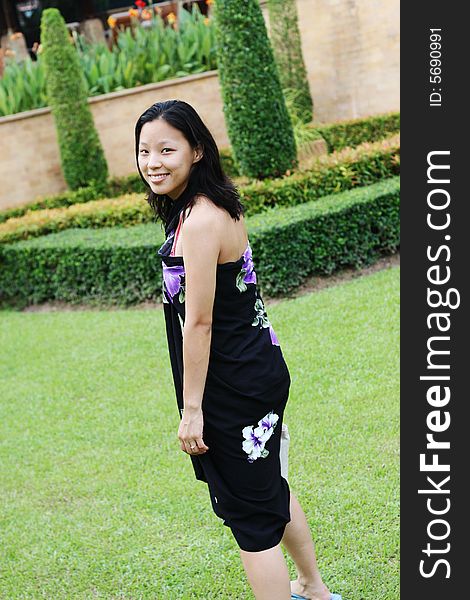 Portrait of a happy Korean woman dressed in a summer sarong. Portrait of a happy Korean woman dressed in a summer sarong.