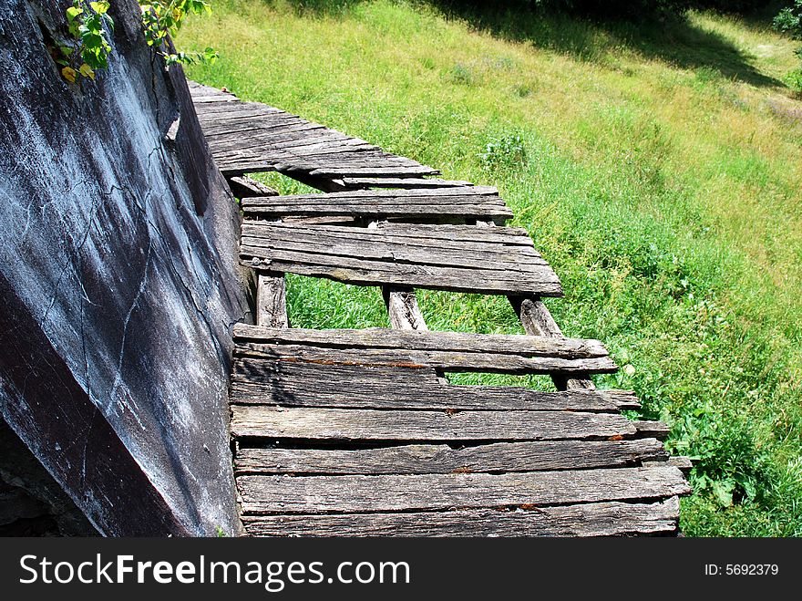 The old wooden and broken balcony