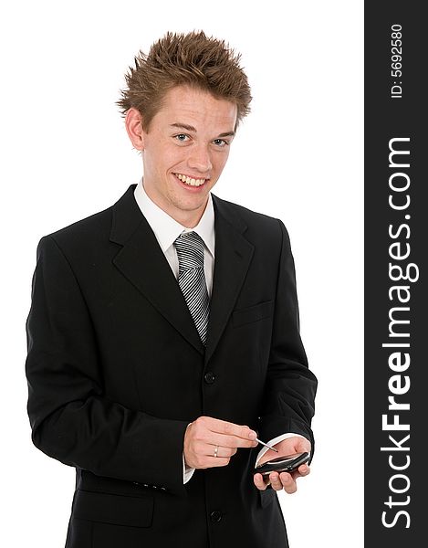 A young businessman on his pda device. A young businessman on his pda device