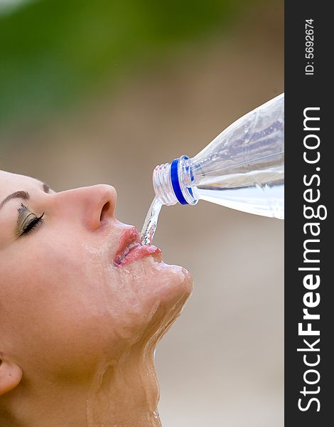 Beautiful woman drinking clear water. Beautiful woman drinking clear water