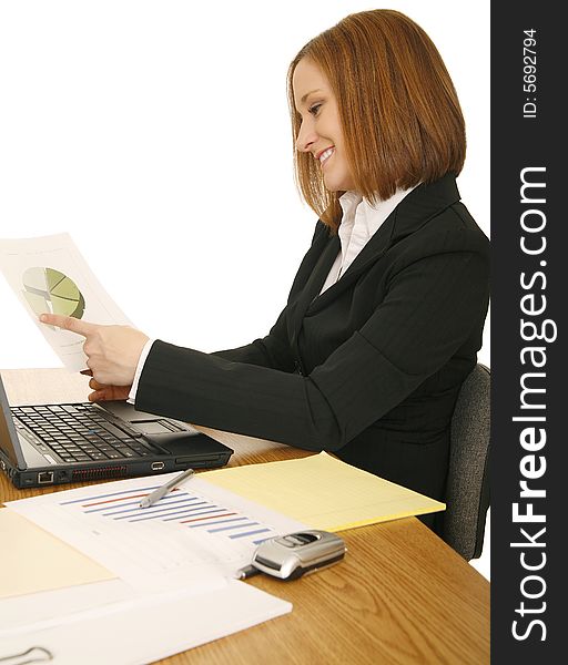 Young business woman on sitting down, working on her table. Young business woman on sitting down, working on her table