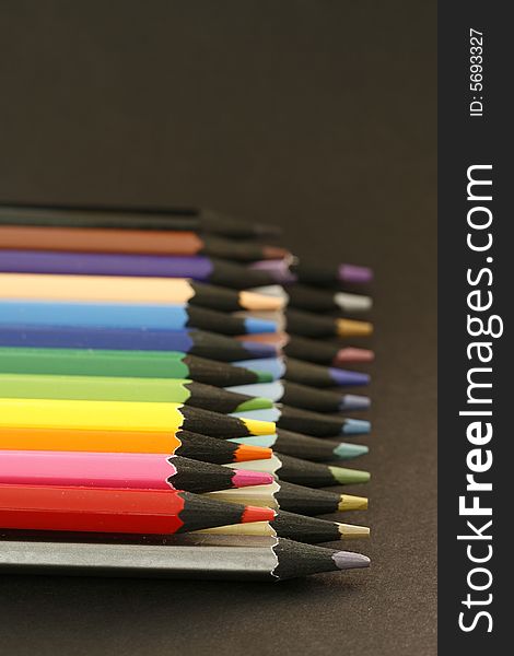 Colors pencils in a simple blackcolor background. Colors pencils in a simple blackcolor background