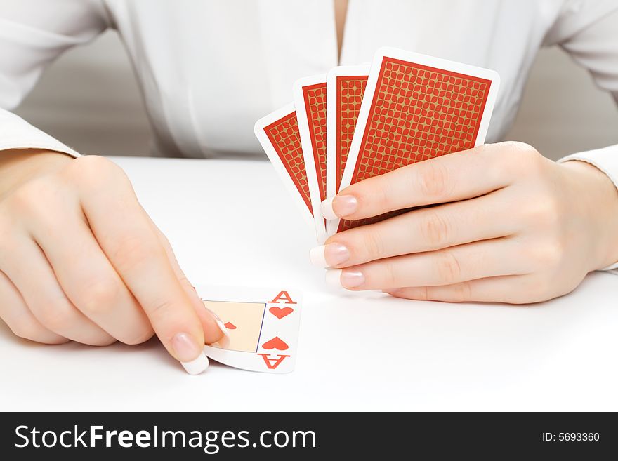 Woman putting the playing card on the table or taking it. Woman putting the playing card on the table or taking it