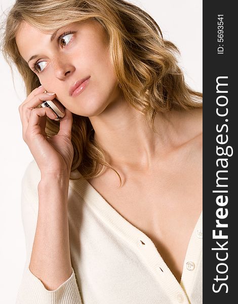 Pretty blond girl talking by mobile phone. Pretty blond girl talking by mobile phone