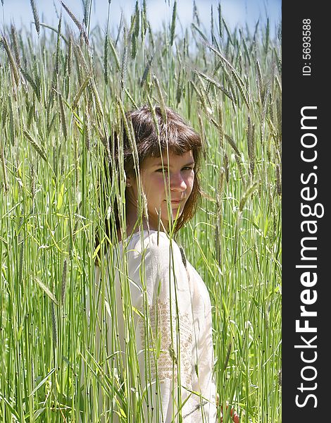 Young Girl In High Grass Field
