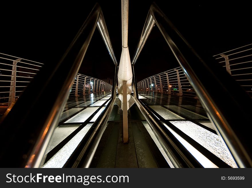 Part of pedestrian bridge at night