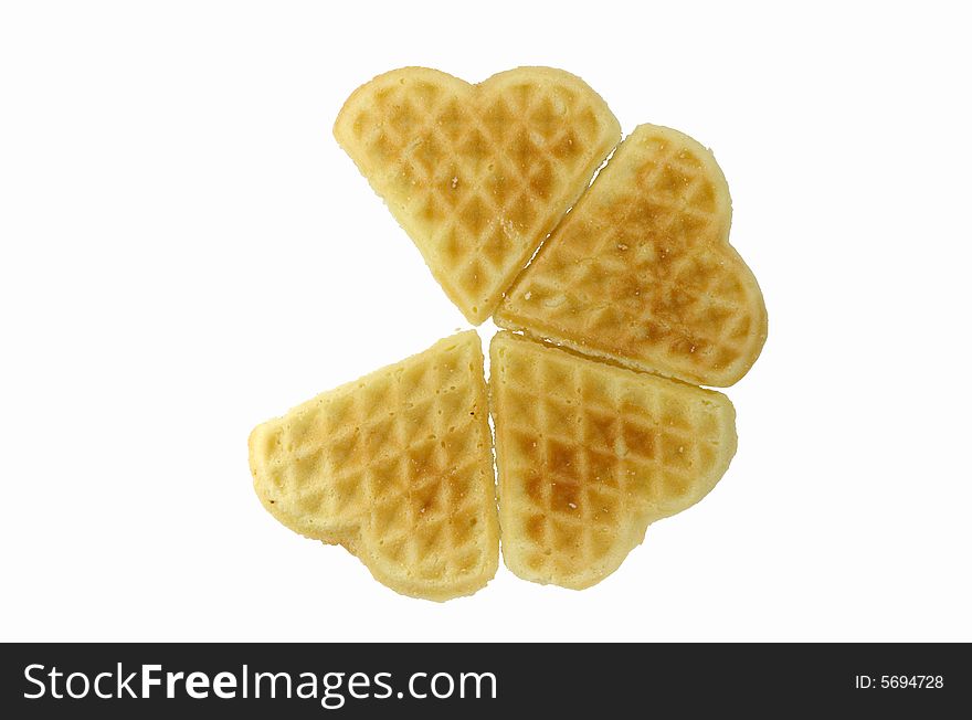 Fresh sweet baking in the form of heart on a white background. Fresh sweet baking in the form of heart on a white background