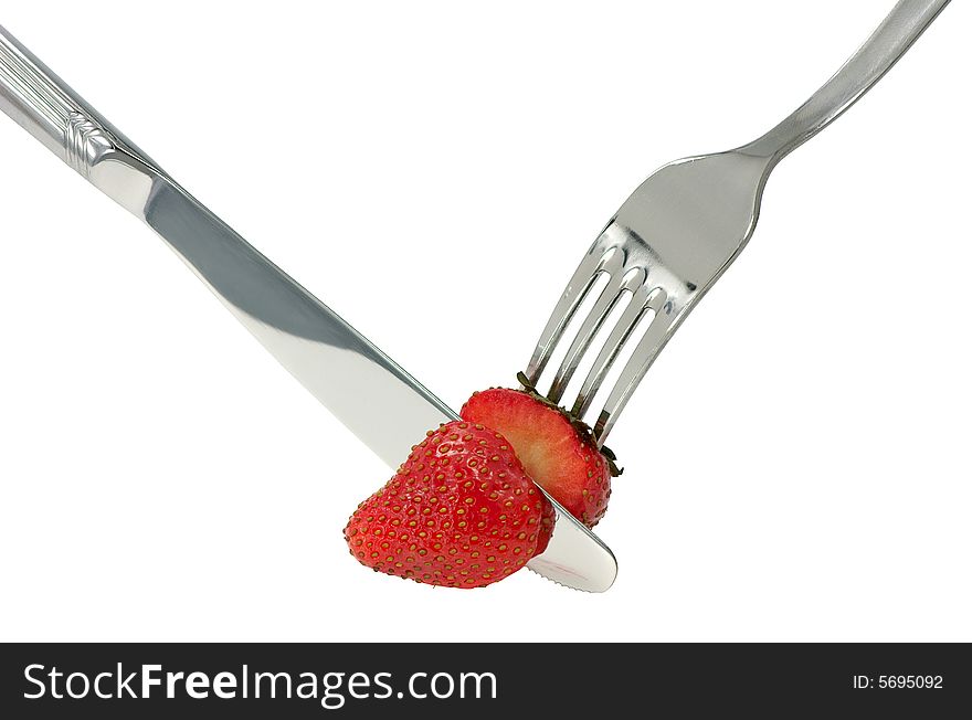 Pieces of a ripe strawberry on a white background. Pieces of a ripe strawberry on a white background