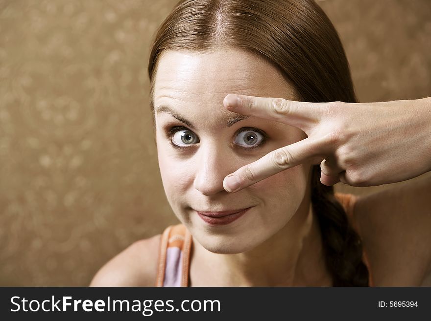 Funny Woman Peeking Out From Between Her Fingers. Funny Woman Peeking Out From Between Her Fingers