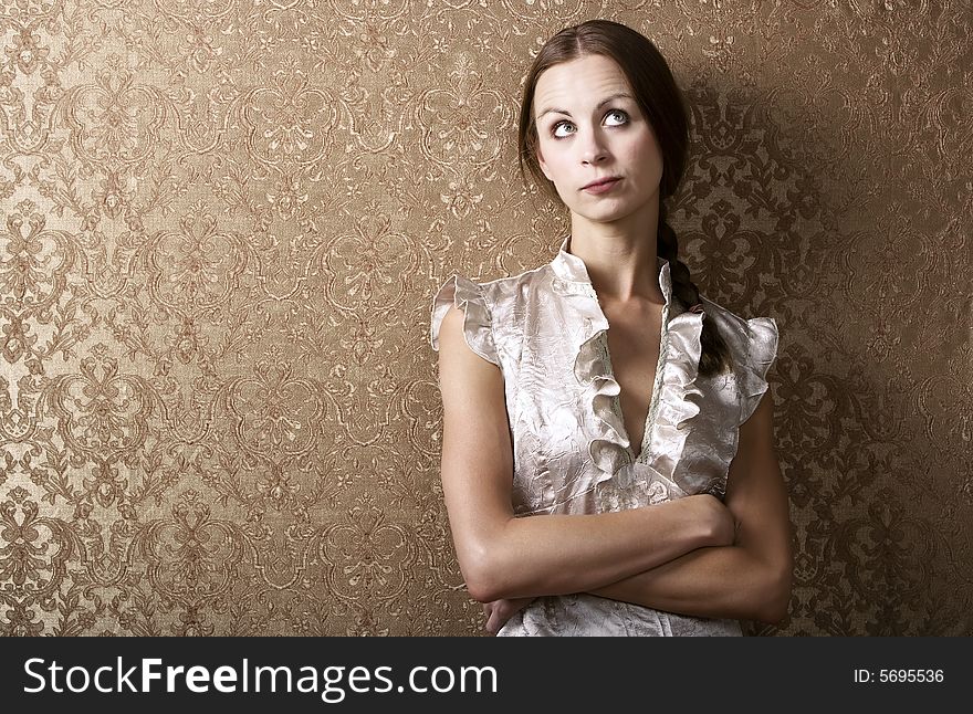 Young Woman Leaning Against A Wall