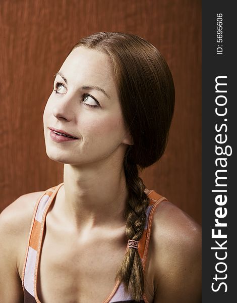 Closeup Portrait of an Attractive Young Woman Looking Up