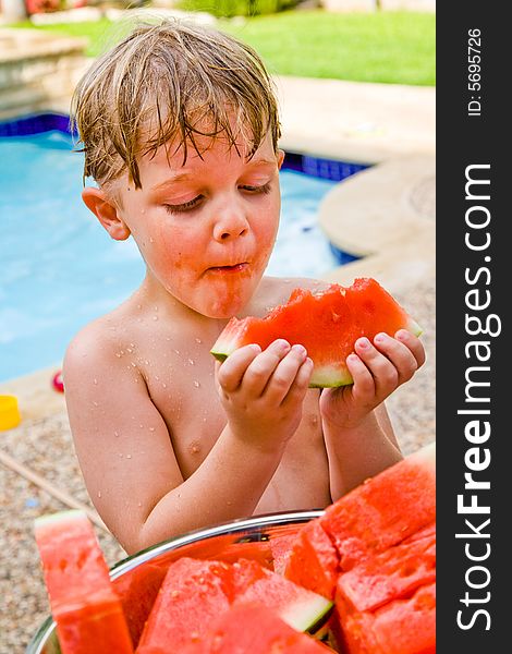 Young Boy Enjoying Watermelon.