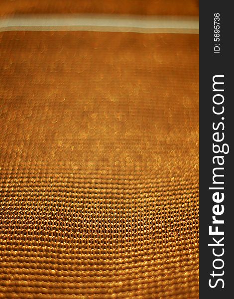 Golden background of net with shallow depth of field