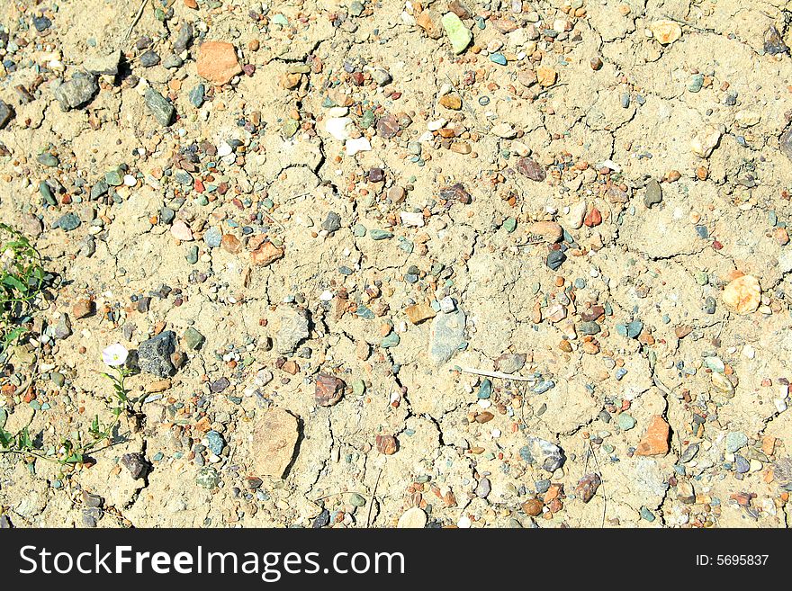 Dry ground with small color stones. Dry ground with small color stones