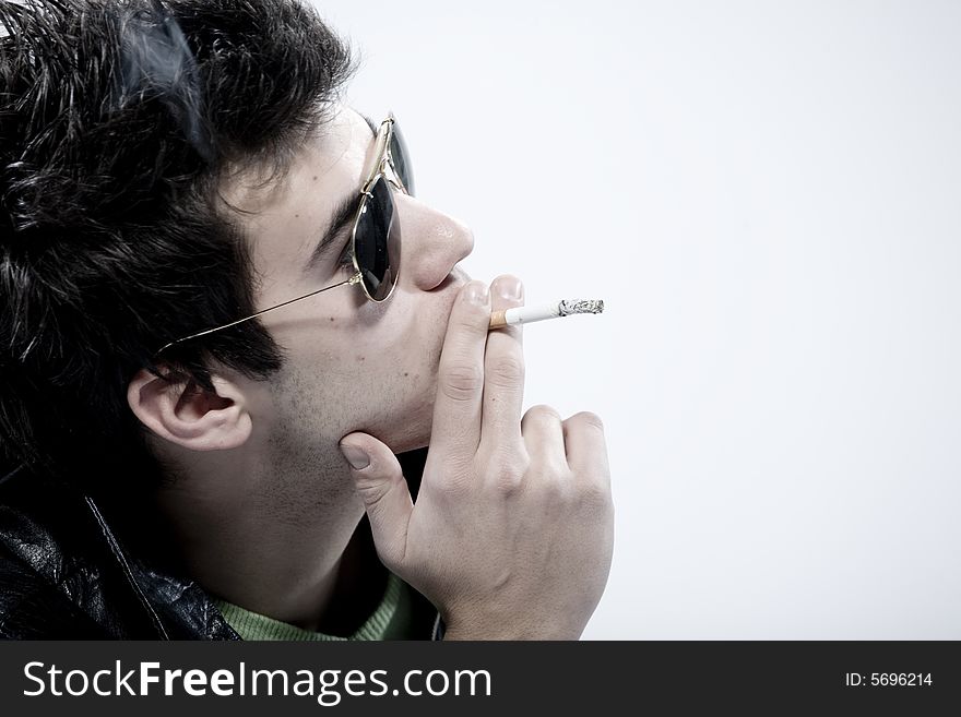 Young boys smoking a cigarette. Young boys smoking a cigarette