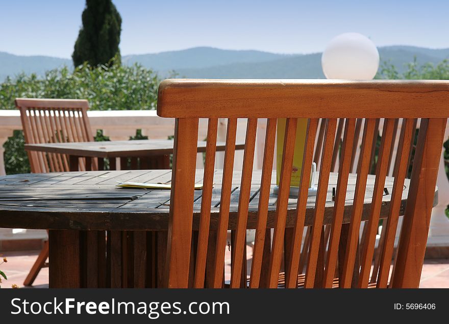 Restaurant table on sunny terrace, french riviera