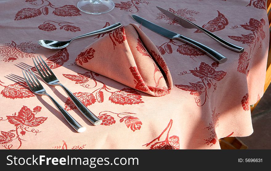 Restaurant table towels and glasses on sunny terrace french riviera balcony and pink. Restaurant table towels and glasses on sunny terrace french riviera balcony and pink