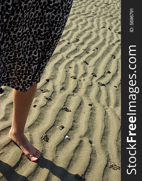 Leg of a lady walking on the beach. Leg of a lady walking on the beach