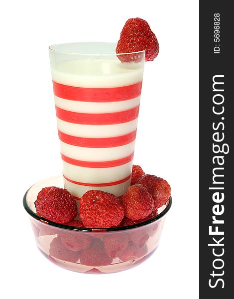 Red strawberry and glass milk on the white background