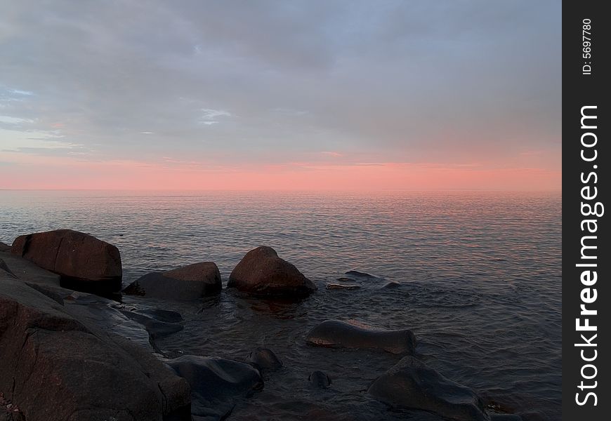 Infinite pastel peach sunset on Lake Superior. Infinite pastel peach sunset on Lake Superior