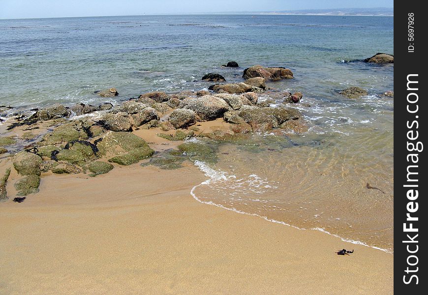 Rocky beach with small wave