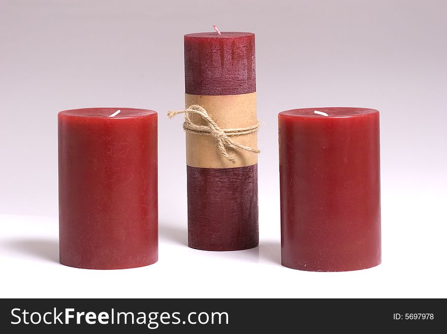 Three Red Candles on a white background