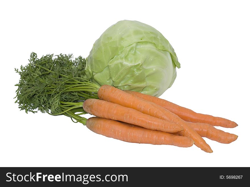 Orange carrots and green cabbage isolated on white background. Orange carrots and green cabbage isolated on white background