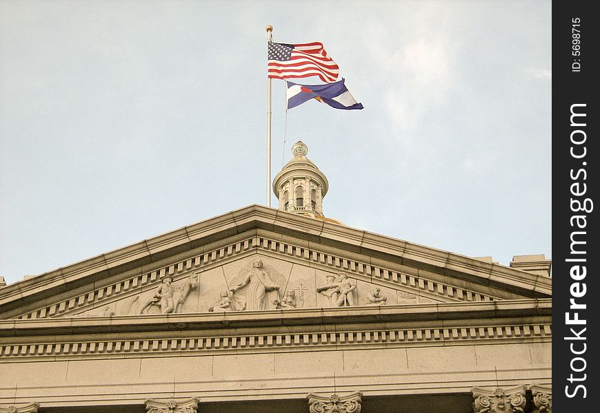 American and Colorado flags on Capitol State building, Denver, Colorado, USA. American and Colorado flags on Capitol State building, Denver, Colorado, USA