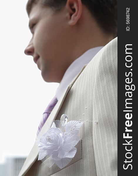 Portrait of handsome man in wedding suite before the ceremony