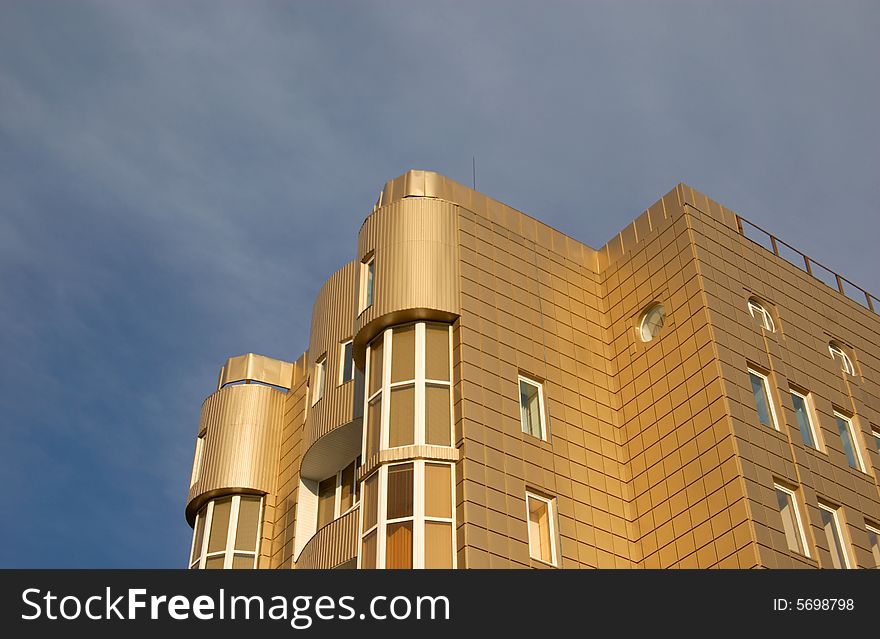 Modern office building over blue sky with clouds. Modern office building over blue sky with clouds
