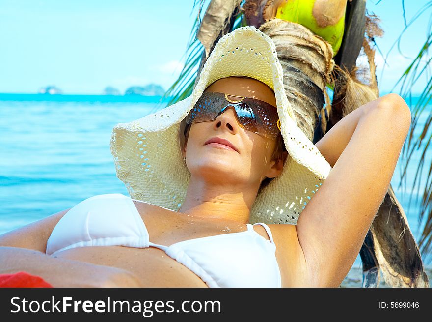 View of nice woman having fun on tropical beach. View of nice woman having fun on tropical beach