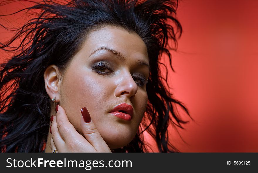 Portrait of  nice young brunette on red back. Portrait of  nice young brunette on red back